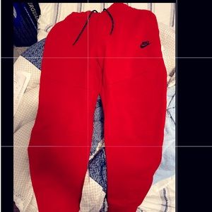 New red Nike tech pants